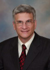 Cropped headshot of Geoffrey B. Thompson